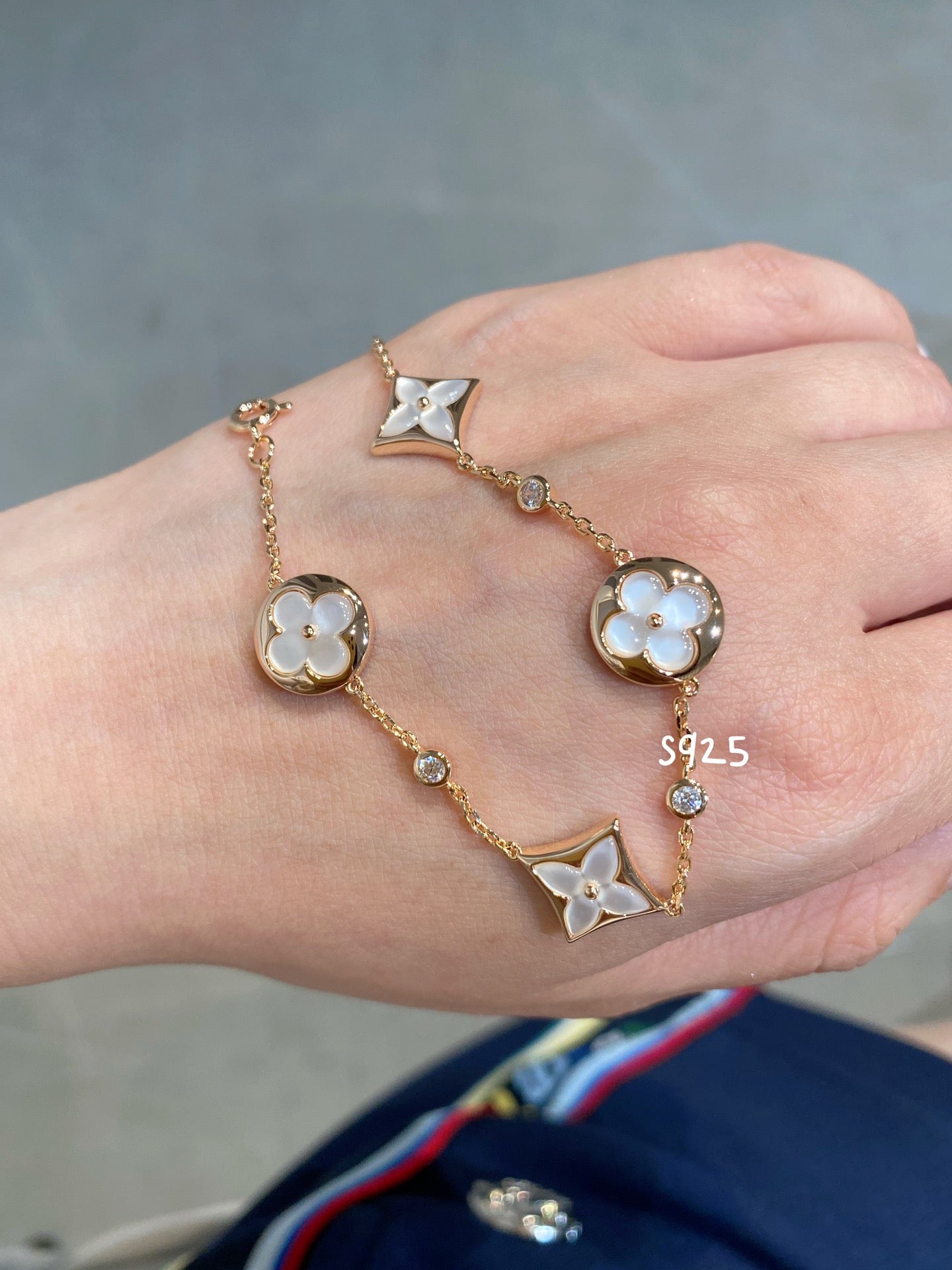 STAR AND SUN 4 MOTIF WHITE MOP PINK GOLD BRACELET